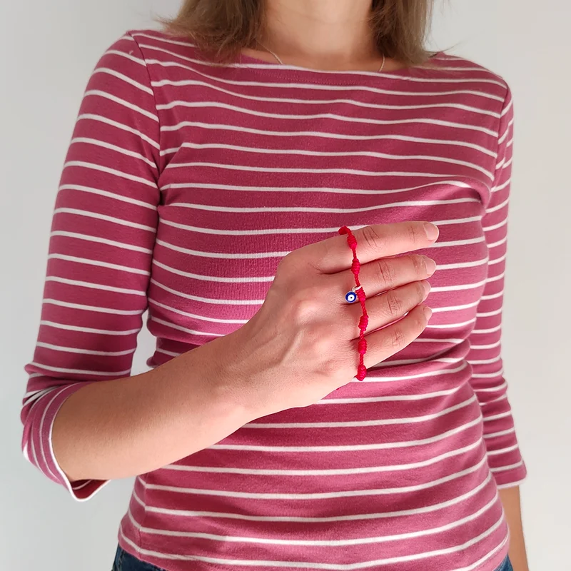 Pulsera siete nudos roja con ojo turco